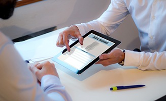 Digital pad with ‘dental insurance’ being viewed